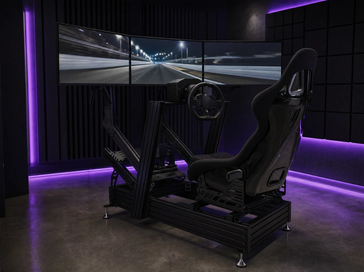 F-160 set up in a dark sim room with three screens on