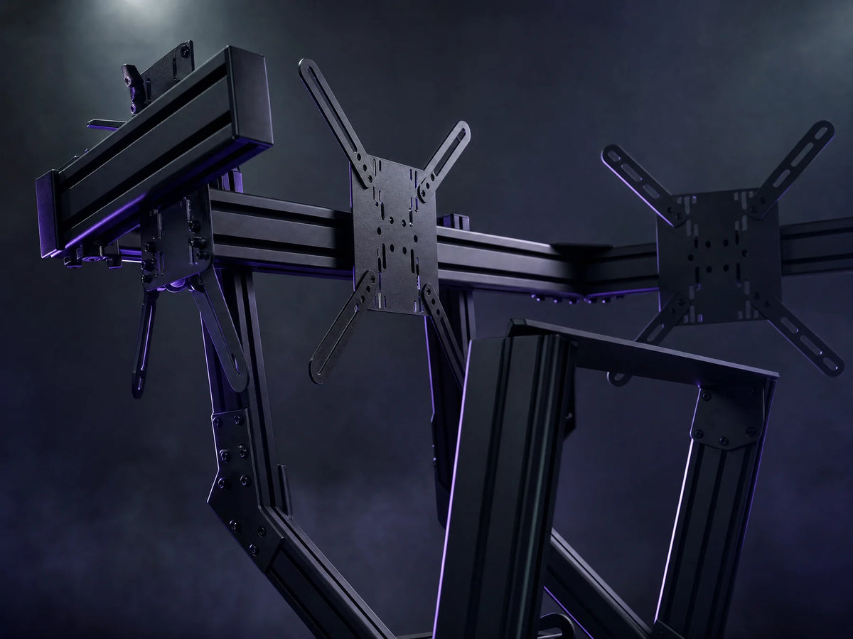 Close-up of the three VESA monitor arms on the top bar