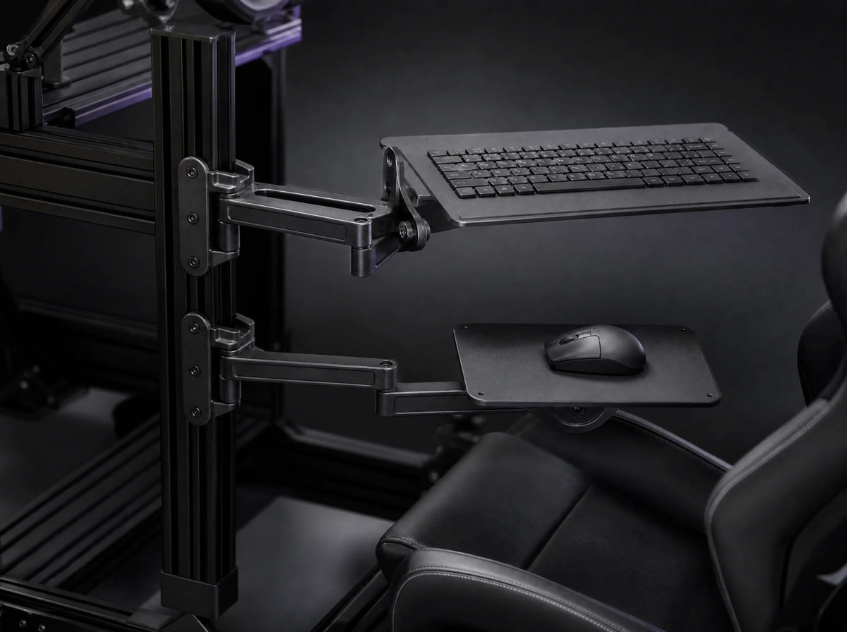 KM-2 arms on a sim rig holding keyboard tray and mouse plate