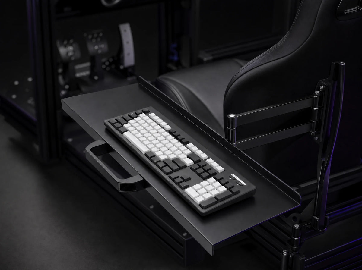 KT-1 keyboard tray mounted beside the seat of a sim rig